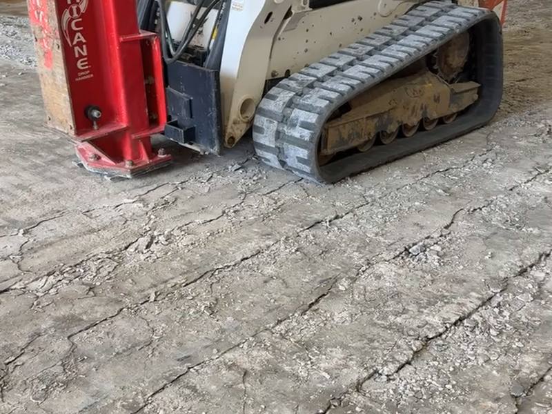 Video: skid steer breaking out and clearing old concrete during demolition