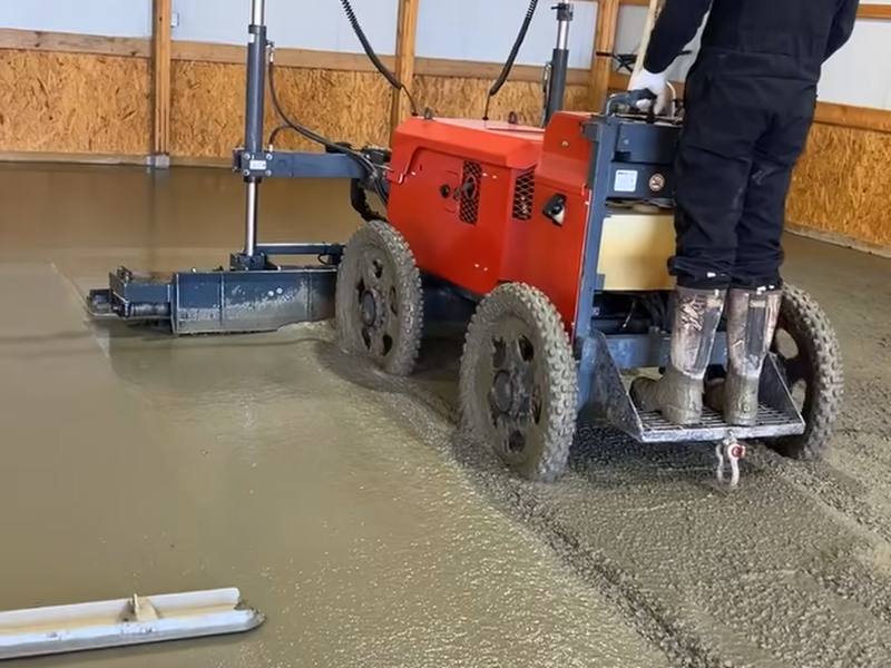 Video: crew member screeding a fresh concrete shop floor
