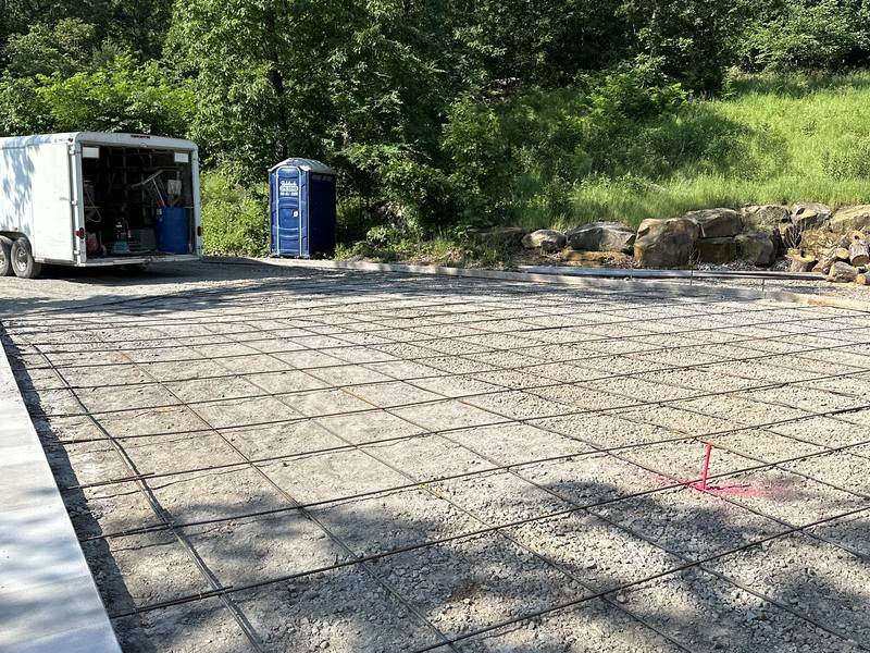 Large reinforced slab area formed and tied out over a gravel base