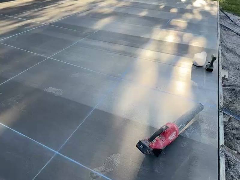 Finished concrete driveway with clean, evenly spaced control joints