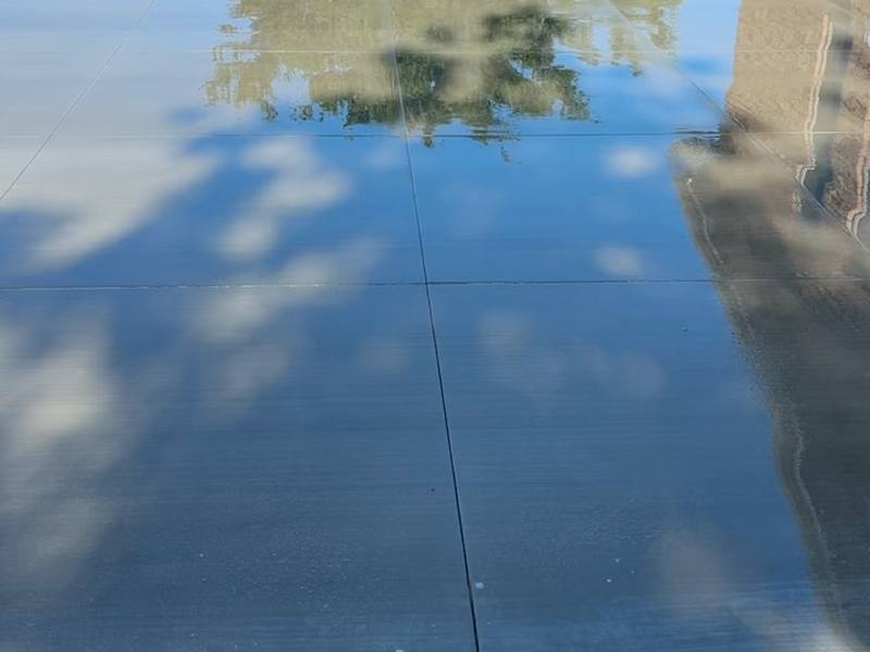 Freshly finished concrete slab with a smooth, glass-like surface